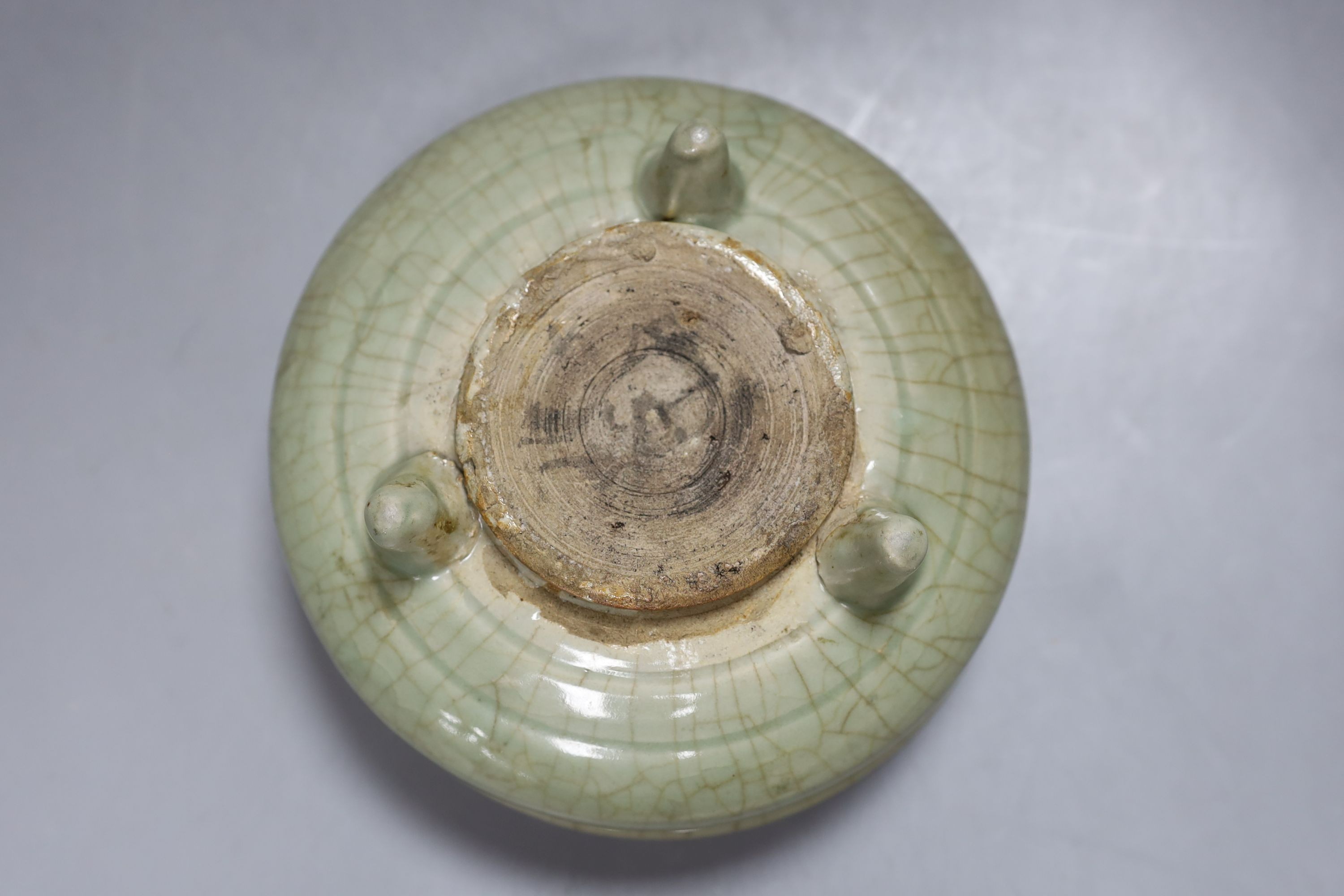 A Chinese Ming Longquan celadon tripod censer, 14th/15th century - 8cm tall